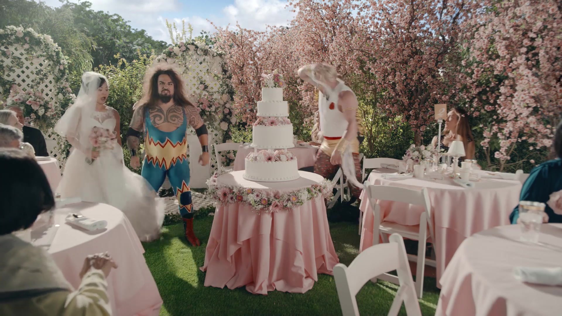 A Day to Remember — Wrestlers interrupt a pastel outdoor wedding reception
